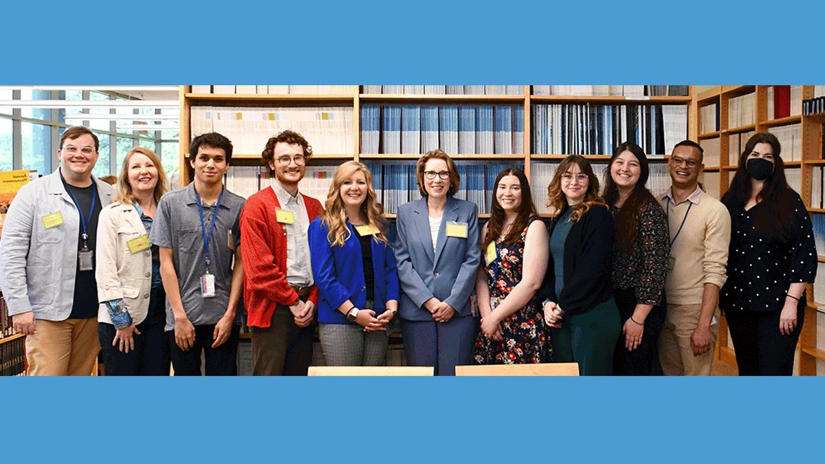 Employees from UNC School of Information and Library Science pose for a photo.